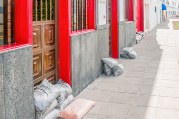 Sandbags protect doors at Arietta, Lanzarote after severe storms and flooding - obrazy, fototapety, plakaty