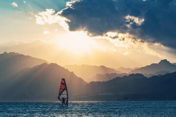 Wind-surfer on the water in Lagoon Dahab area at sunset, Sinai, EgyptWind-surfer on the water in Lagoon Dahab area at sunset, Sinai, Egypt