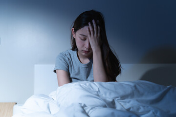 Anxiety disorder on insomnia woman concept, sleepless Woman open eye awakening on the bed at night time can't sleep from symptom of depression diseased.