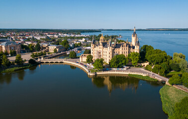 Aerial drone shot of the city of Schwerin and Schwerin Castle in northern Germany, surrounded by beautiful lakes