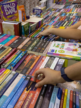 Limassol, Cyprus, November 18th, 2023: Choosing a book at the Limassol International Book Fair 
