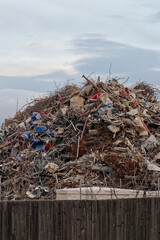 Scrap metal recycling compound viewed from boundary fence