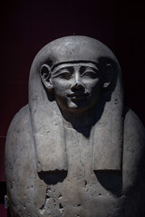 Fototapeta na wymiar CAIRO, EGYPT - 02 SEP 02, 2023: A stone sarcophagus with a face in the Cairo Museum