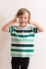 Portrait of a happy little boy on a white background