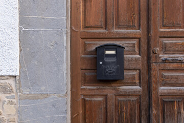 Mailbox on the door of a house in the town