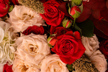 Autumn bouquet of red and white roses, hydrangeas, chrysanthemums as a background.