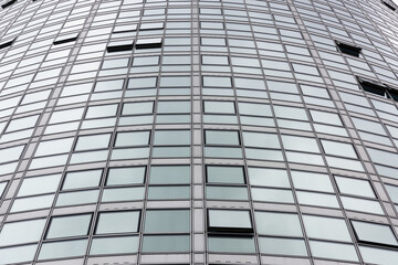 Looking up at the windows of a circular round multi-storey office and apartment building, 