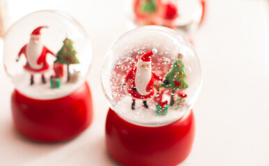 Christmas glass snow globe with Santa Claus home decoration at xmas market closeup
