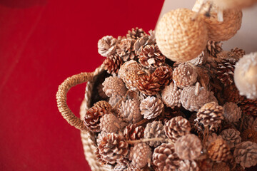 pine cones eco christmas decorations in a basket at xmas market. Holiday season gift shopping.