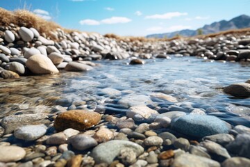 A picture of a stream of water flowing over rocks. Perfect for nature and outdoor-themed designs