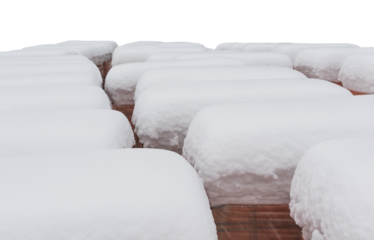 Construction facing bricks on a pallet, powdered with thick snow