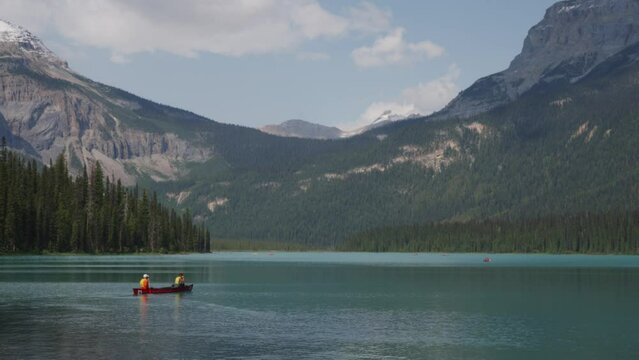 Serene Canoe Trip on a Crystal Clear Mountain Lake