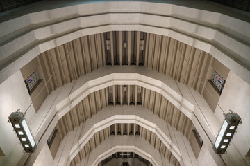 Art Deco interiors of Catholic minor basilica national shrine with massive dome and arch vaults,...