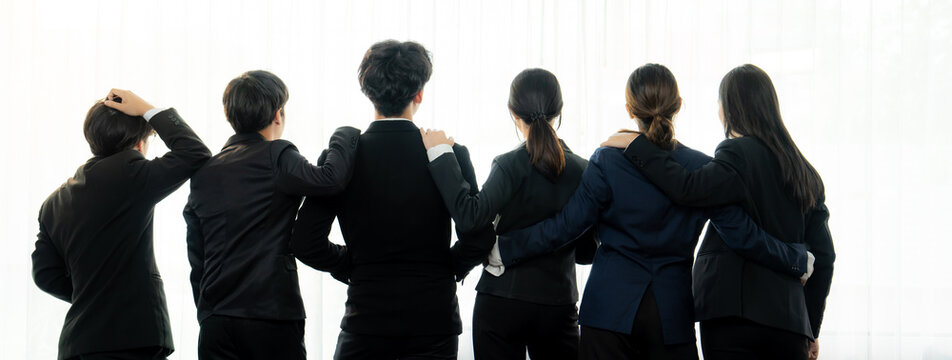 Panoramic banner back view of office worker team standing in line together with friendship posture symbolize successful professional teamwork and job employment, HR agency recruitment concept. Shrewd