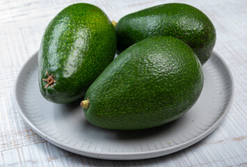 Green ripe avocado fruits from organic avocado plantation - healthy food