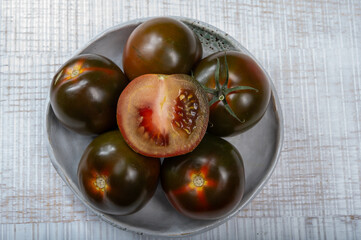 Fresh ripe sweet reddish brown and green kumato tomatoes