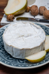 French soft Camembert cheese, original Camembert de Normandie, with white mold