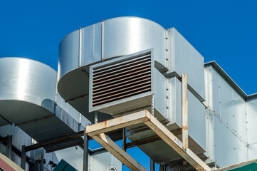 Naklejka premium Close-up of ventilation system on roof of building