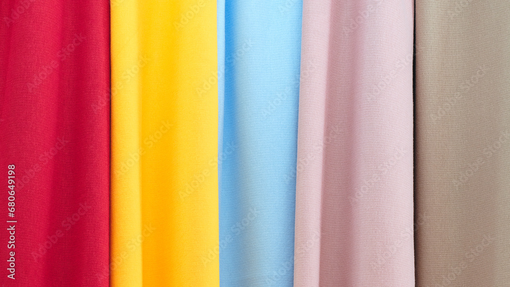 Poster mix colorful hanging vertical stripe textile, fabrics, cloths on the rack. texture of multicolored f
