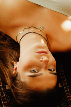 Vintage style portrait of young white woman on living room floor