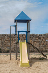 Children's slide seen from the front in a children's area