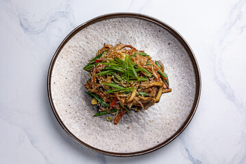 Asian cuisine. Noodles with vegetables. Close-up