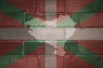map and flag of basque country on a old brick wall