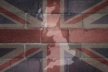 map and flag of great britain on a old brick wall