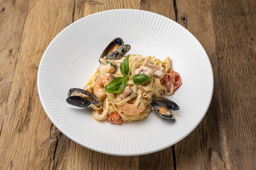 Italian cuisine. Pasta with seafood, mussels and shrimps. Close up