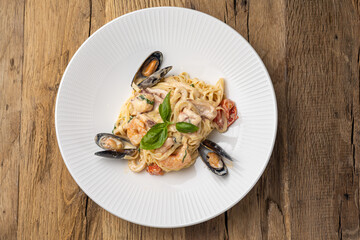 Italian cuisine. Pasta with seafood, mussels and shrimps. Close up