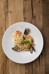 Italian cuisine. Pasta with seafood, mussels and shrimps. Close up