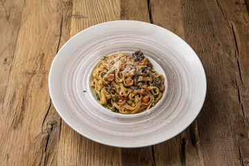 Italian cuisine. Pasta with meat and vegetables. Close up