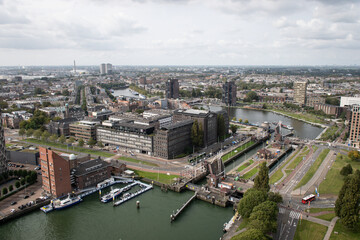 Small park harbour lock in Rotterdam centre. Dutch, Kleine Parkhavensluis in Parkhaven connects to the river Nieuwe Maas on land the sluis joins parts of the city and school De Rotterdamse Snijschool
