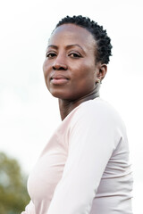 Portrait of serious black mature woman outdoors.