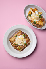 Ukrainian cuisine. pancakes with sour cream and almond flakes . Close-up