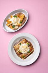 Ukrainian cuisine. pancakes with sour cream and almond flakes . Close-up