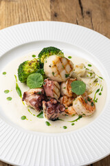 Grilled seafood with broccoli and sauce