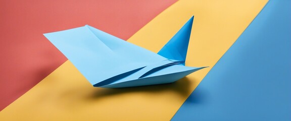 Naklejka premium Autism awareness. paper plane in origami style with autism awareness ribbon on blue background.