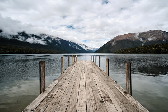 wooden pier on lake in new zealand, nelson lake