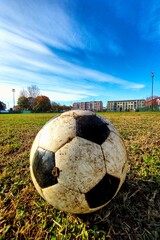 football in a winter field with muddy ground