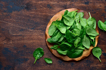 Fresh spinach leaves. Top view with copy space.