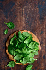 Fresh spinach leaves. Top view with copy space.