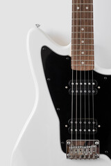 Fototapeta na wymiar close-up photo of a white electric guitar on a white background
