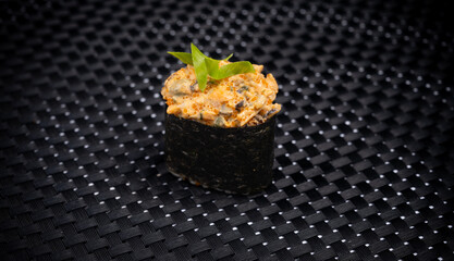 Sushi on a black background. Japanese snack.