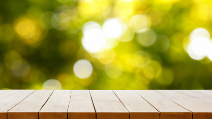 Wooden table top on blurred green background - can be used for display or montage your products. Picknick in sunshine