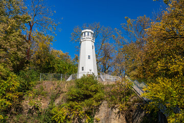 White structure of the Mark Twain Memorial lighthouse on a bluff above Hannibal in Missouri by...
