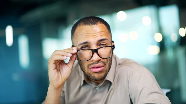 Wonder employee entrepreneur man looks at canera read unbelievable astonish news excited guy male Shocked with mobile phone receive smartphone sms amazed say wow shock amazement at business office