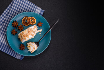 A piece of delicious sweet meringue roll with mascarpone cheese, berries and almonds