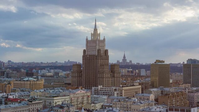 Timelapse of One of the Seven Sister Skyscrapers in Moscow, Russia. Iconic Landmark from Stalin's Era, Illuminated Cityscape Arial view with clouds