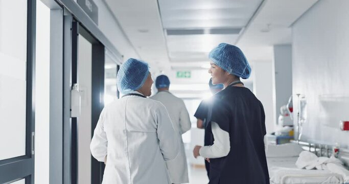 Discussion, hospital and doctors walking for teamwork, collaboration and advice for diagnosis. Healthcare, meeting and health workers in corridor for results, medical research and patient report